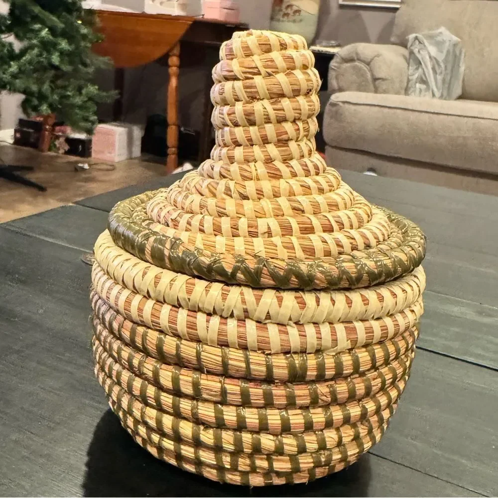 Handwoven sweetgrass coiled basket with a fitted lid